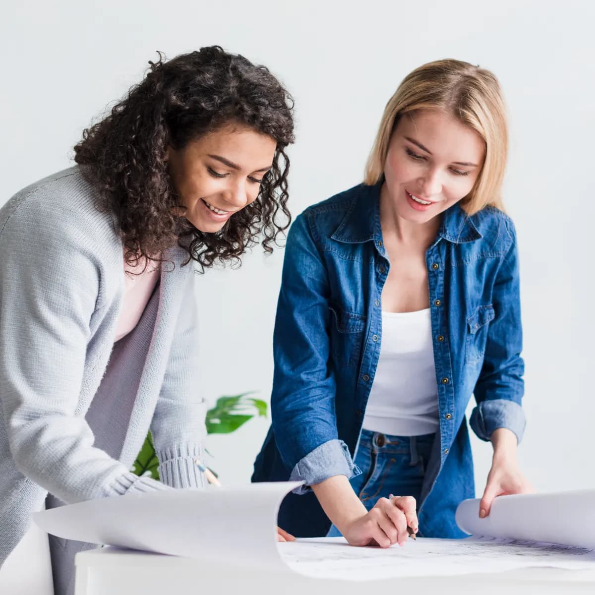 multiracial-smiling-employees-working-with-papers